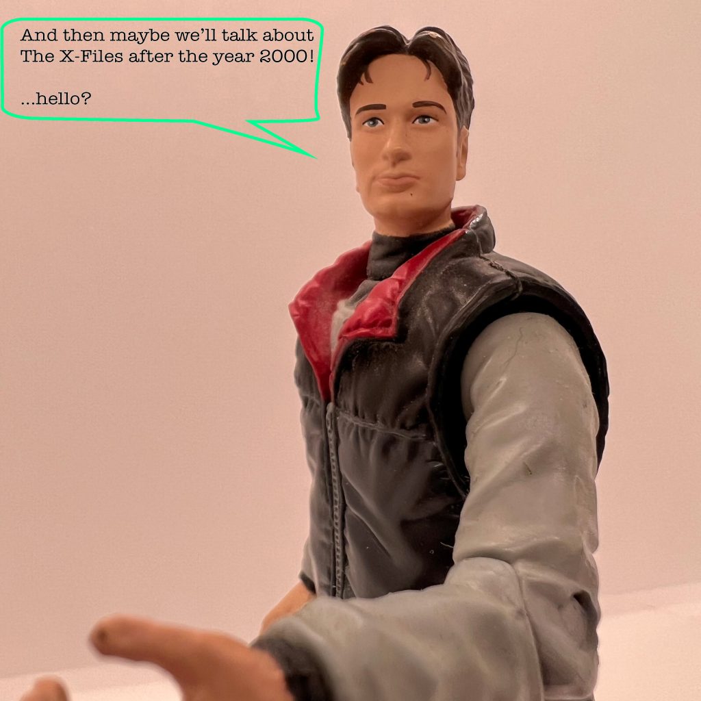 Fox Mulder from The X-Files in action figure form. He says "And then maybe we'll talk about The X-Files after the year 2000! ...Hello?"