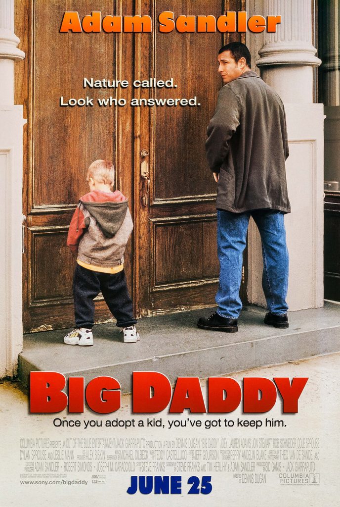 A father and son urinate on a large wooden door.
