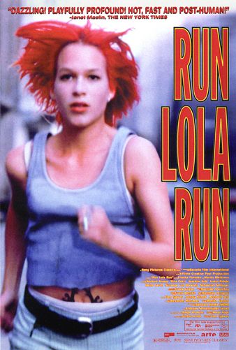 A young woman with blazing red hair runs towards the camera.